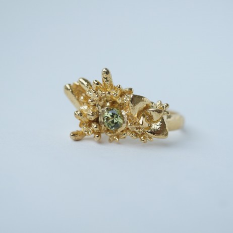 Lopsided ring with green sapphire